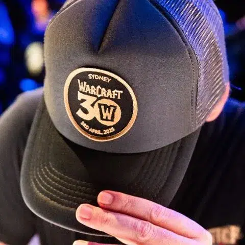 Grey trucker hat with custom Warcraft patch at activation.