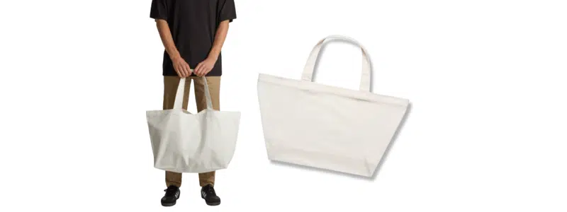 Oversized white canvas tote bag, handheld