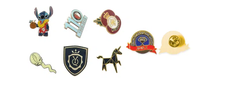 Collection of enamel pins with nostalgic and playful designs