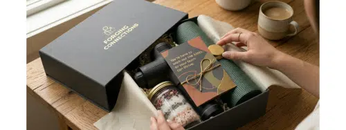 Beautifully presented Wellness Box including yoga mat, massage gun, bath salts and personalised card.