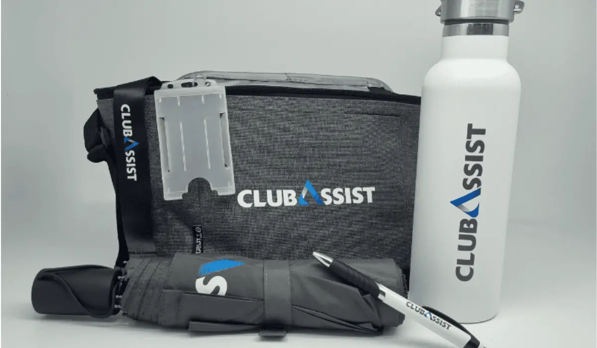 Branded gift set with a logo cooler bag, insulated water bottle, compact umbrella, and pen.