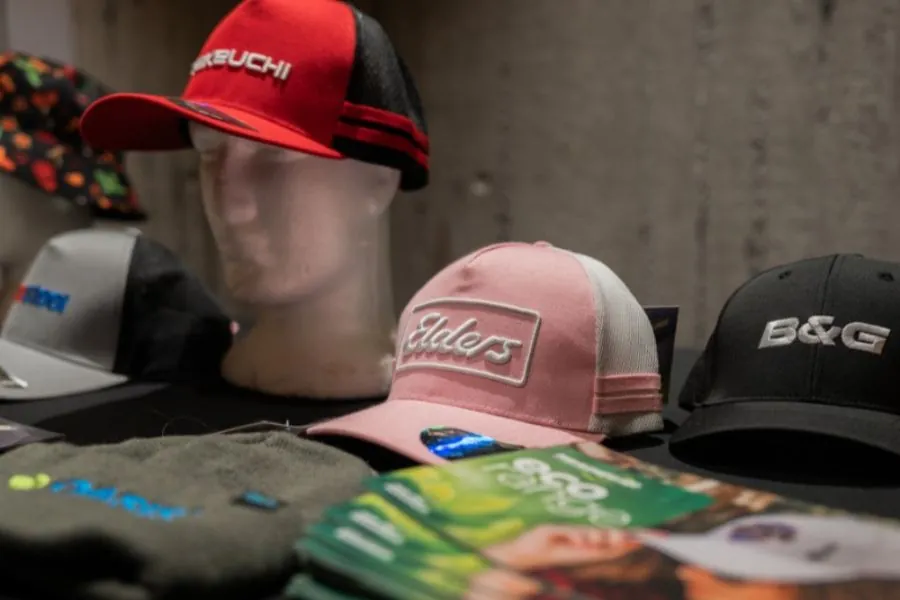 Latest Trends Branded caps and apparel on display showing the latest promotional merchandise trends
