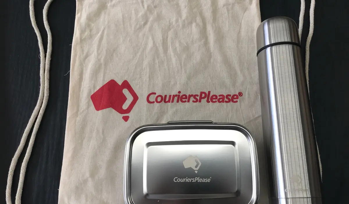 Branded corporate gifts for CouriersPlease with a logo drawstring bag, flask and tin