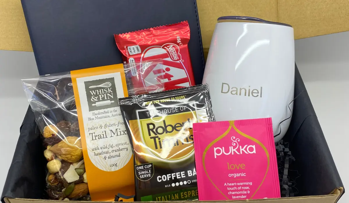 Personalised hamper with a name-engraved bottle, trail mix, coffee and tea